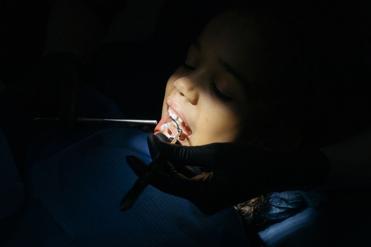 A child receiving dental treatment